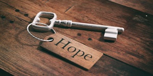Metal key with wooden hope sign attached AdobeStock_138241329.jpeg